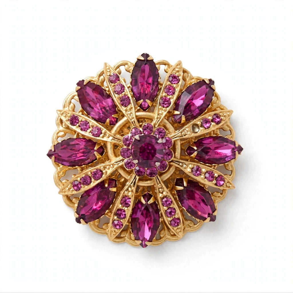 Circa 1950’s-1960’s gold-tone filagree brooch with vibrant magenta & pink navette rhinestones