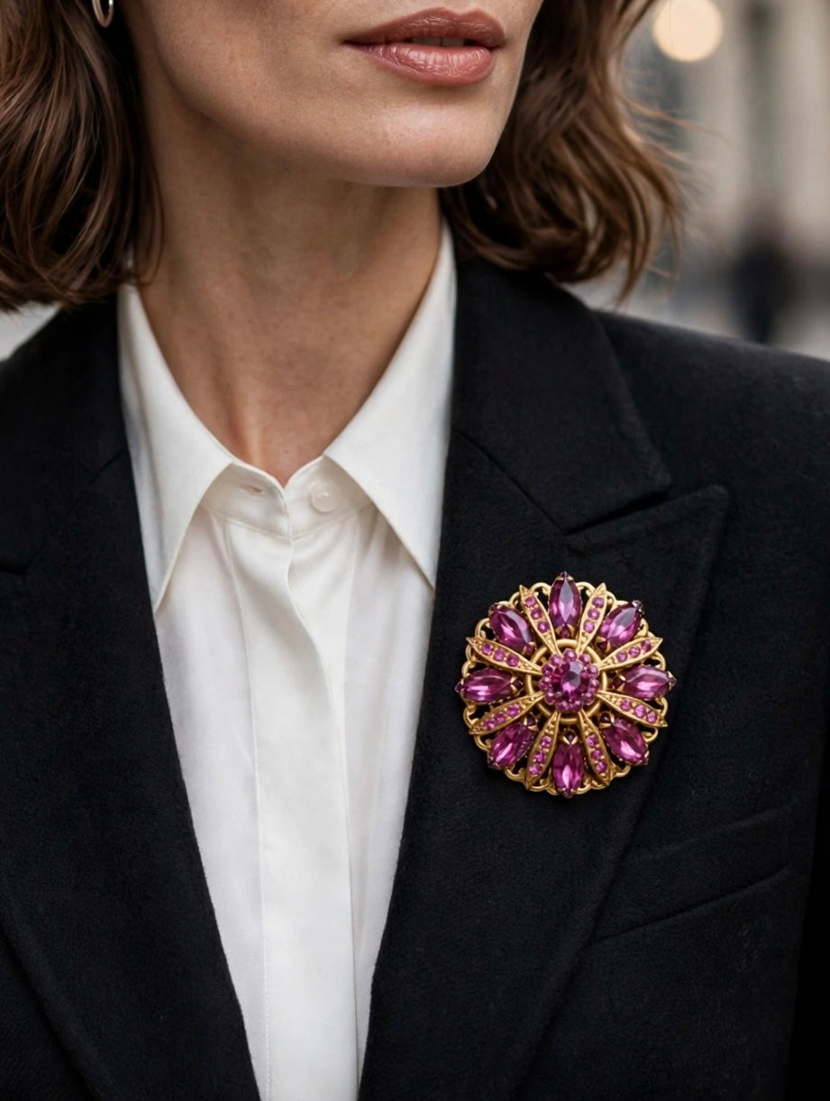Circa 1950’s-1960’s gold-tone filagree brooch with vibrant magenta & pink navette rhinestones